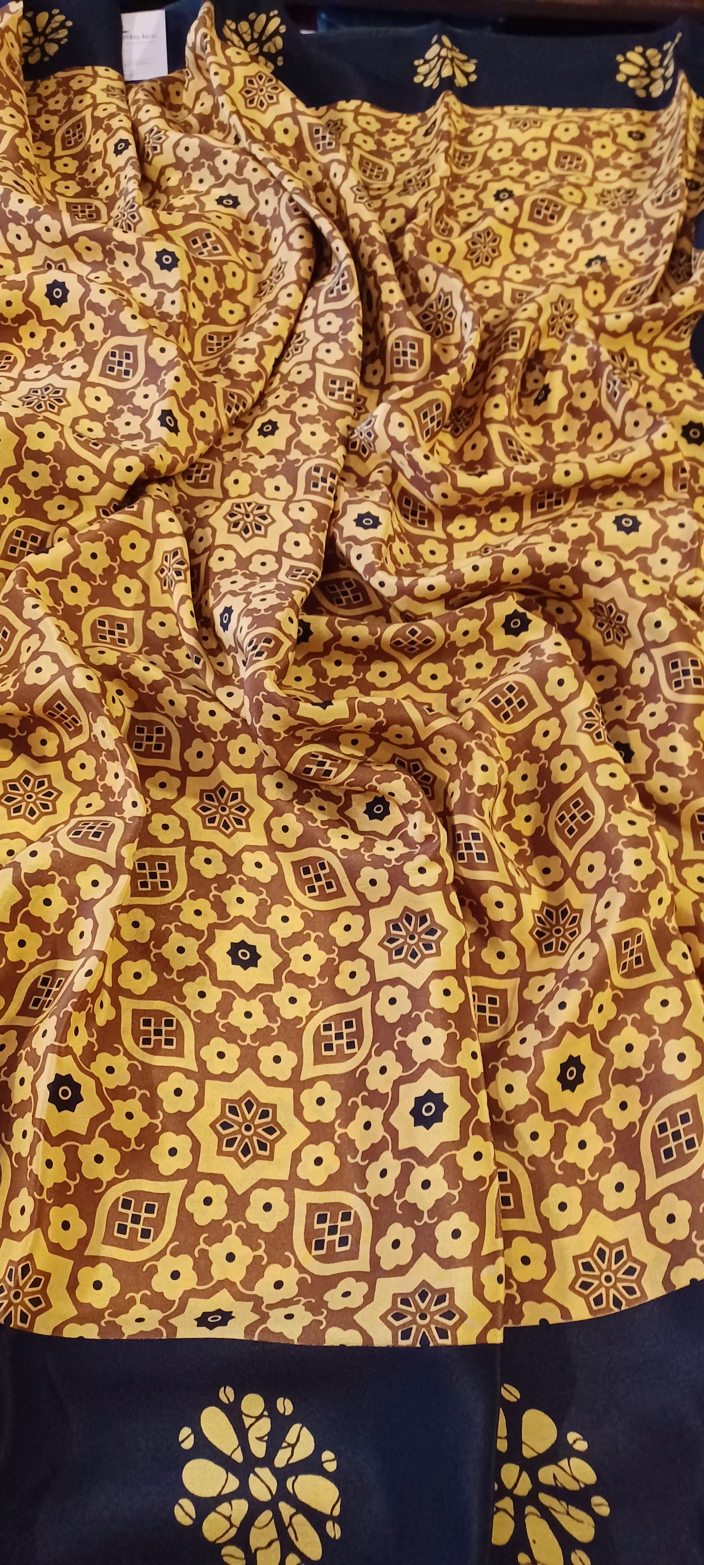 Mustard Yellow and black printed Pure Crepe Silk Saree