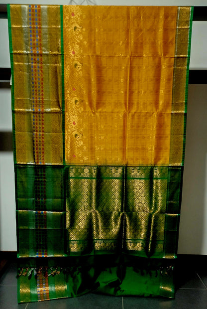 Mango yellow with green and zari woven big border Kanchi Kuppadam saree