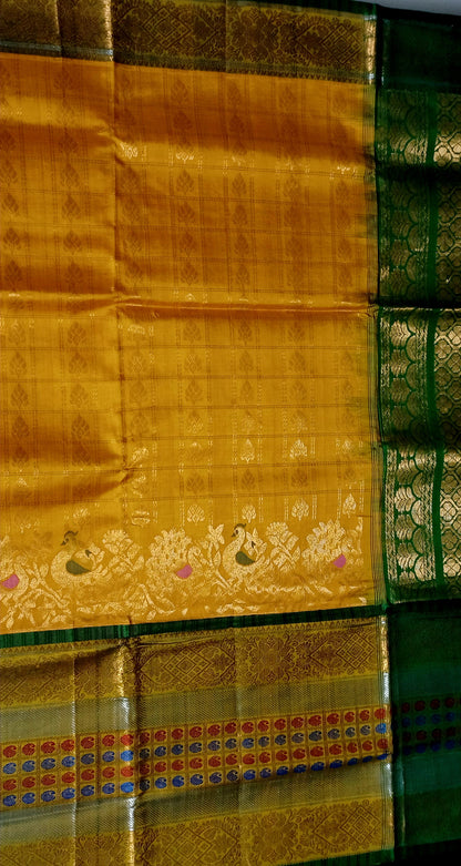 Mango yellow with green and zari woven big border Kanchi Kuppadam saree