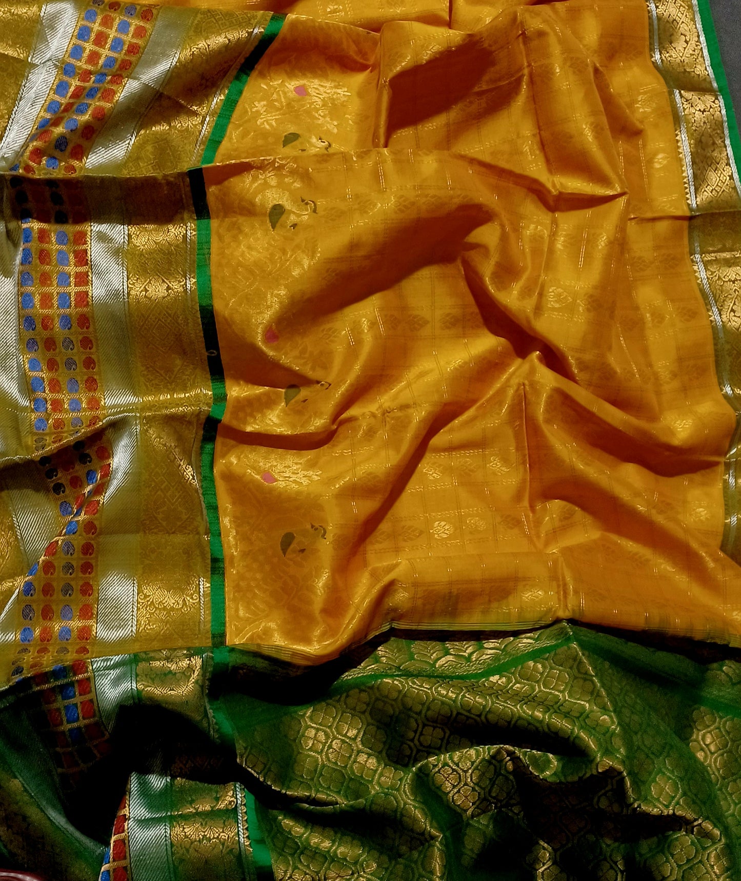 Mango yellow with green and zari woven big border Kanchi Kuppadam saree