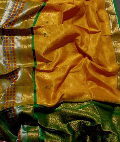 Mango yellow with green and zari woven big border Kanchi Kuppadam saree