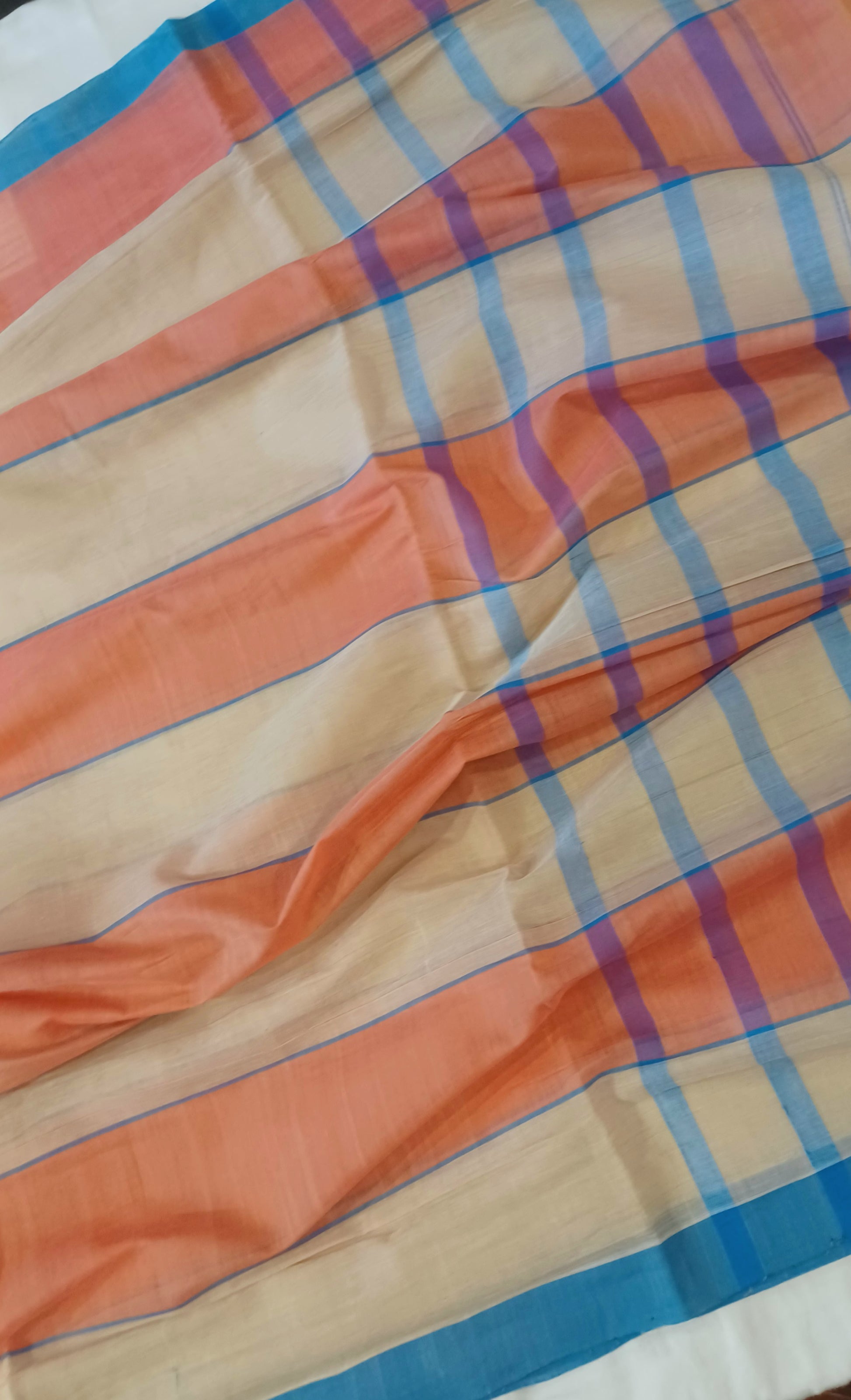 Beige and peach handwoven Bobbili cotton saree with solid horizontal stripes closeup.